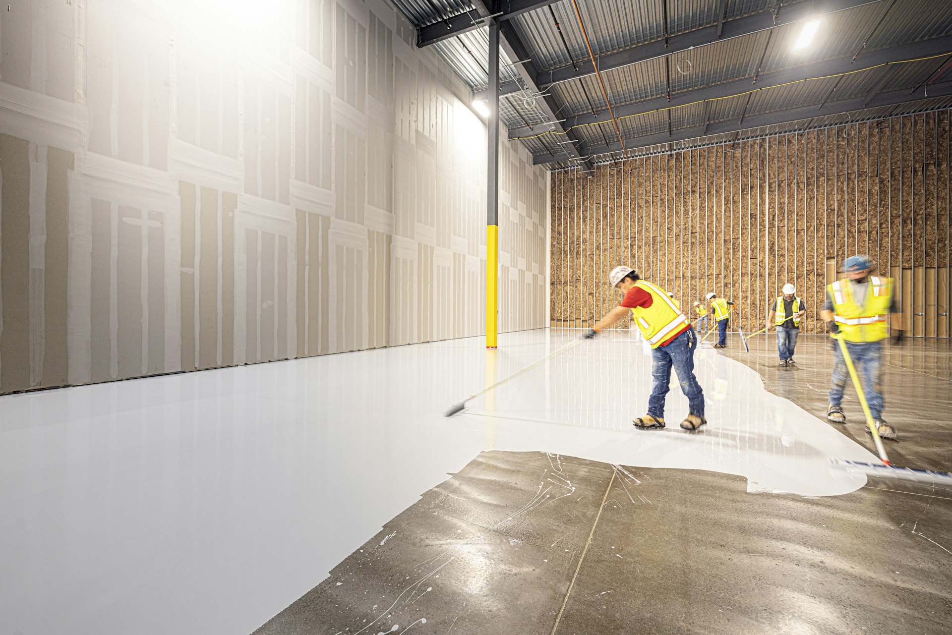 Crew applying a floor coating