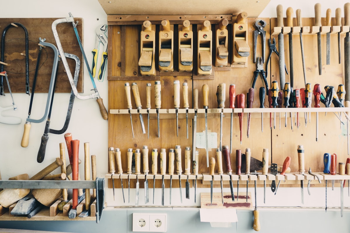 Hand tools organised on a workshop wall